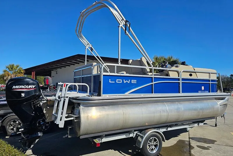 Slide: The Image of 2023 Lowe Ultra 180 Cruise pontoon boat with Mercury outboard engine on trailer. - 4