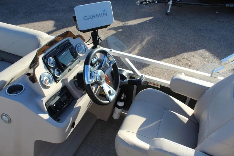 Slide: The Image of Cockpit of 2022 Avalon Venture Fish N Cruise 22 FT with Garmin navigation system. - 13