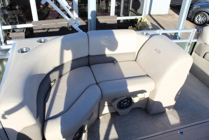 Slide: The Image of 2022 Avalon Venture Fish N Cruise 22 FT boat seating with cup holders and speaker. - 16