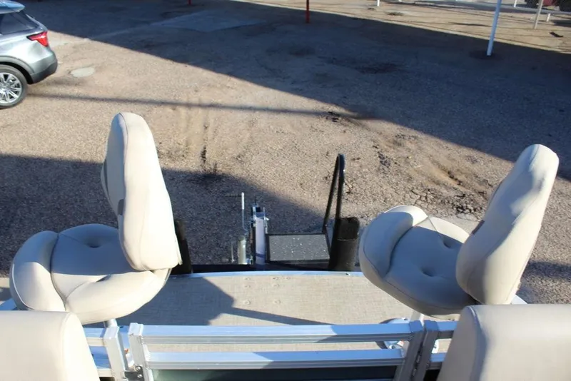 Slide: The Image of 2022 Avalon Venture Fish N Cruise 22 FT boat seats, beige upholstery, outdoor setting. - 18