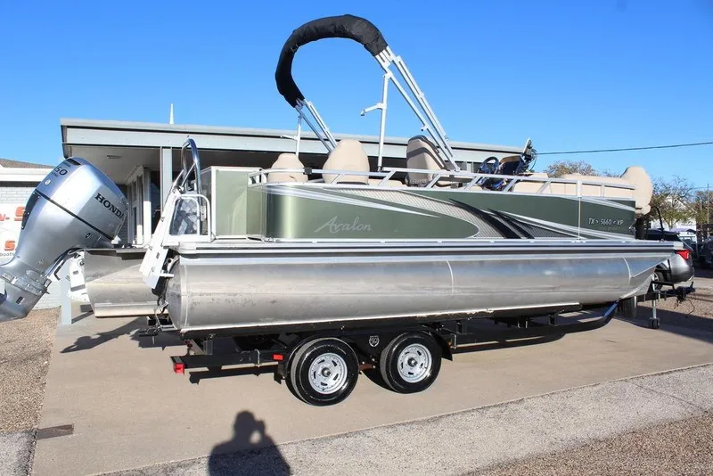 Slide: The Image of 2022 Avalon Venture Fish N Cruise 22 FT pontoon boat with Honda outboard motor. - 3