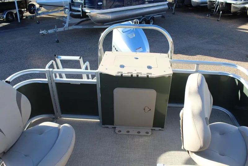 Slide: The Image of 2022 Avalon Venture Fish N Cruise 22 FT boat interior with seating and storage. - 7