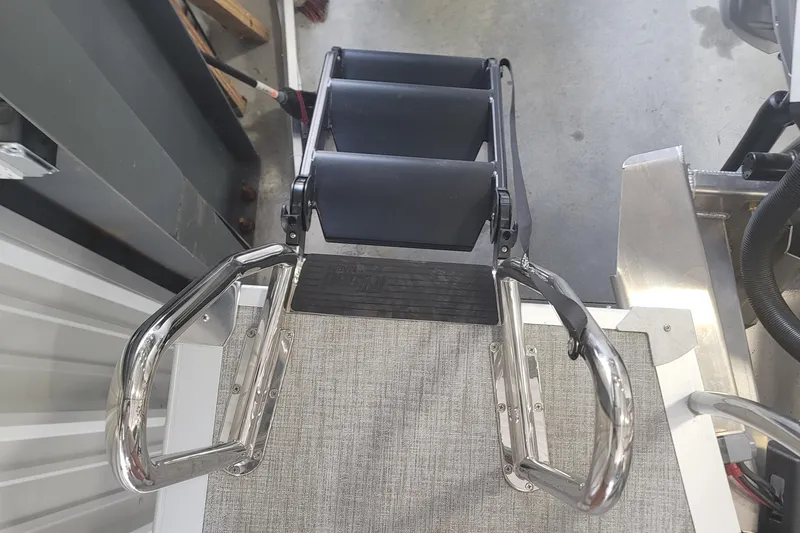 Slide: The Image of Boarding ladder on 2026 Avalon Platinum Catalina 2585 Windshield Cruise Rear Bench boat. - 10