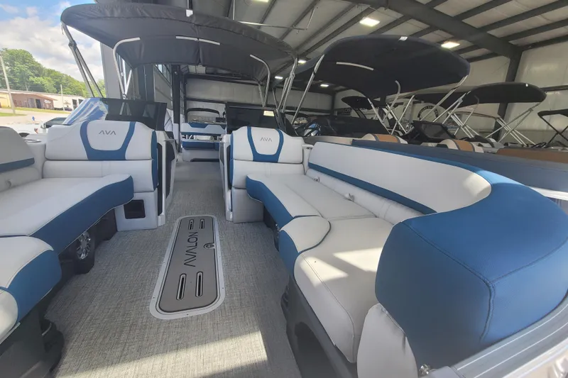 Slide: The Image of 2026 Avalon Platinum Catalina 2585 Windshield Cruise Rear Bench, featuring luxurious seating in a showroom. - 9