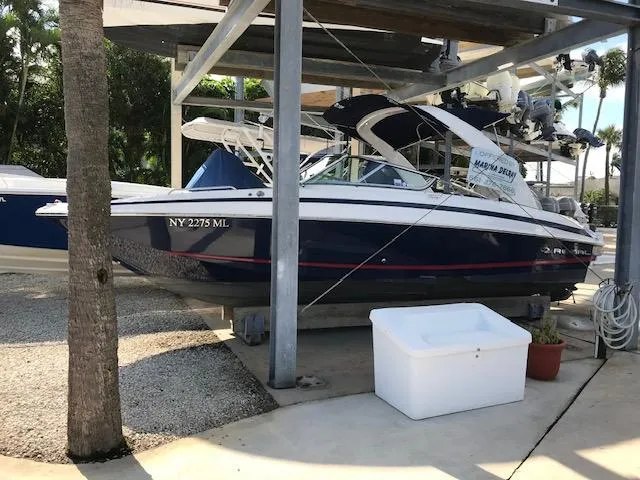 Slide: The Image of 2014 Regal 2700 Bowrider boat in storage, side view. - 10