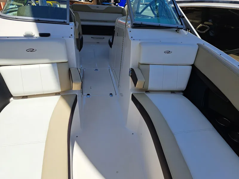 Slide: The Image of 2014 Regal 2700 Bowrider interior with white and beige seating. - 19