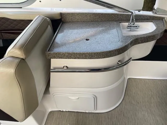 Slide: The Image of 2014 Regal 2700 Bowrider boat interior with sink and countertop. - 21