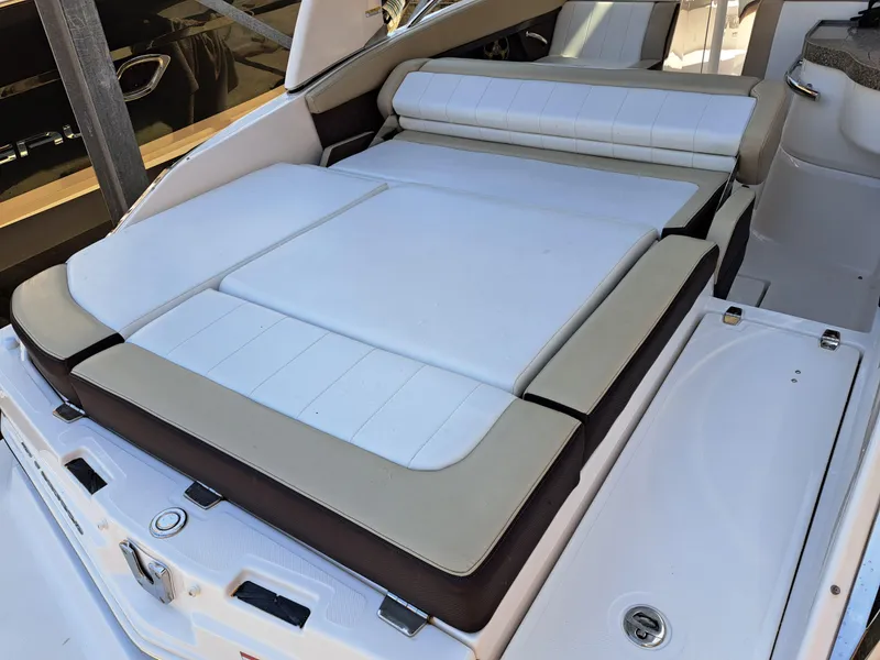 Slide: The Image of 2014 Regal 2700 Bowrider boat with spacious sunpad and comfortable seating. - 27