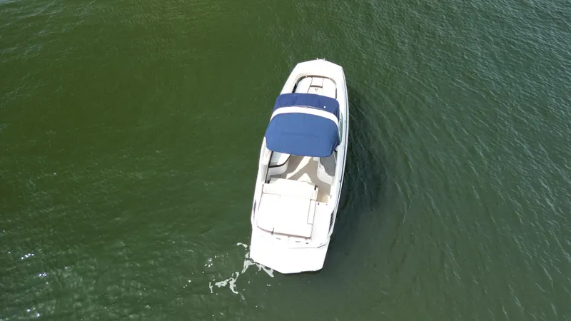 Slide: The Image of 2014 Regal 2700 Bowrider boat on open water, aerial view. - 3