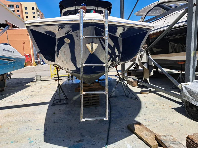 Slide: The Image of 2014 Regal 2700 Bowrider boat on dry dock with ladder and support stands. - 37