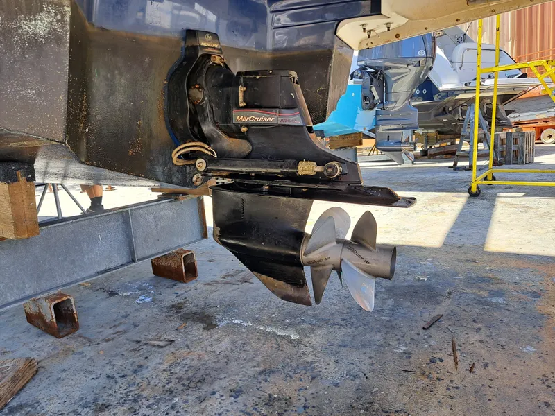 Slide: The Image of 2014 Regal 2700 Bowrider boat with MerCruiser outdrive in a boatyard. - 43