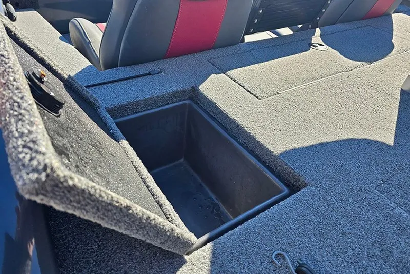 Slide: The Image of 2022 Ranger RT188 boat storage compartment with open lid, showcasing interior space. - 11