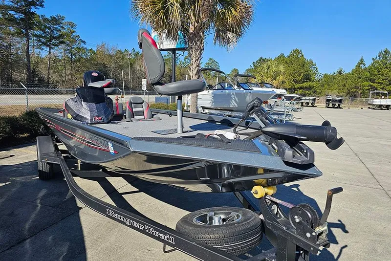 Slide: The Image of 2022 Ranger RT188 boat on trailer in sunny outdoor setting. - 3