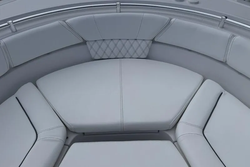 Slide: The Image of 2026 Sportsman Heritage 261 Center Console boat seating area with cushioned upholstery. - 10