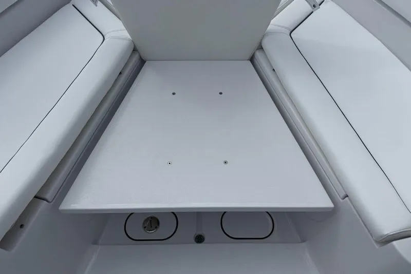 Slide: The Image of 2026 Sportsman Heritage 261 Center Console boat interior with cushioned seating. - 12