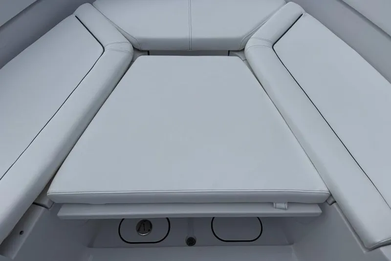 Slide: The Image of 2026 Sportsman Heritage 261 Center Console boat interior with cushioned seating. - 16