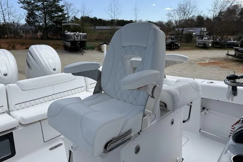 Slide: The Image of Luxurious seating on 2026 Sportsman Heritage 261 Center Console boat. - 18
