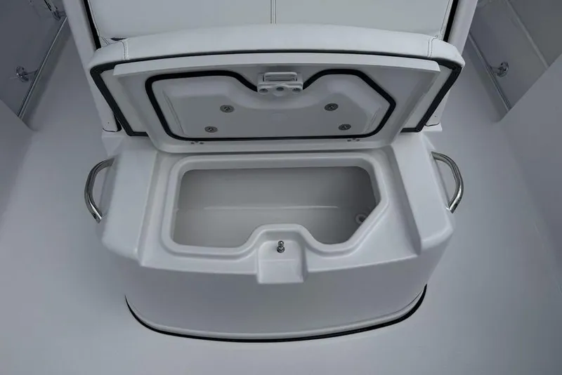 Slide: The Image of Open storage compartment on 2026 Sportsman Heritage 261 Center Console boat. - 20