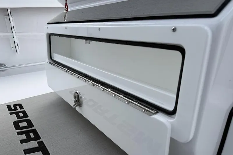Slide: The Image of 2026 Sportsman Heritage 261 Center Console storage compartment detail. - 25