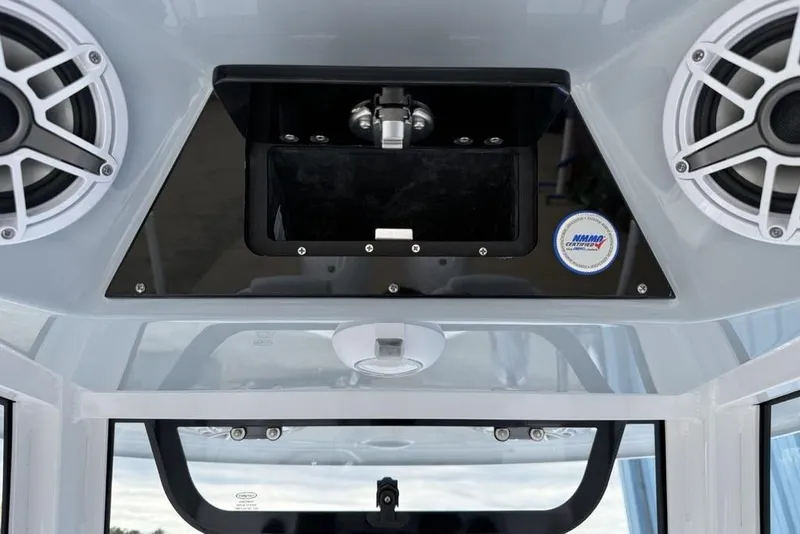 Slide: The Image of 2026 Sportsman Heritage 261 Center Console boat speakers and control panel. - 26