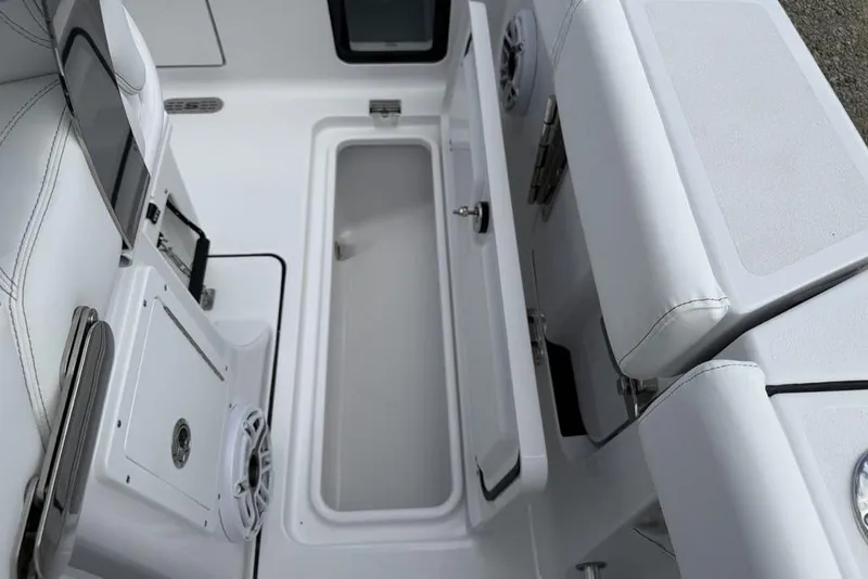 Slide: The Image of 2026 Sportsman Heritage 261 Center Console interior with storage compartments and seating. - 31