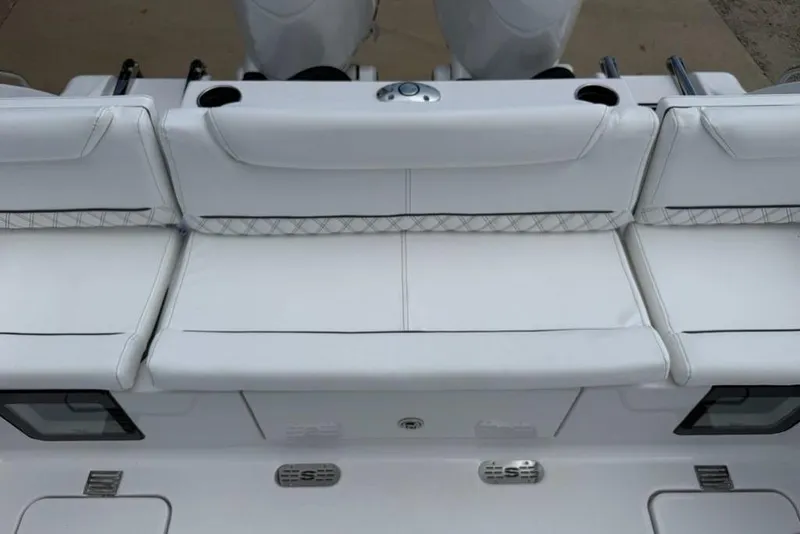Slide: The Image of 2026 Sportsman Heritage 261 Center Console boat with white cushioned seating. - 36