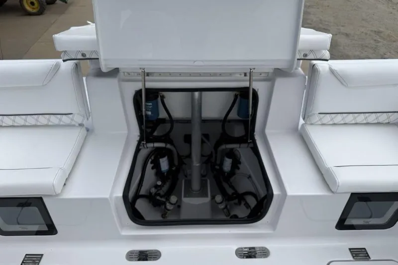 Slide: The Image of 2026 Sportsman Heritage 261 Center Console boat interior with seating and storage compartments. - 38