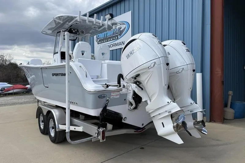 Slide: The Image of 2026 Sportsman Heritage 261 Center Console boat with twin Yamaha engines on a trailer. - 4