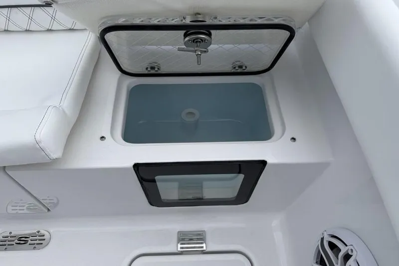 Slide: The Image of 2026 Sportsman Heritage 261 Center Console livewell with cushioned seating and storage. - 41