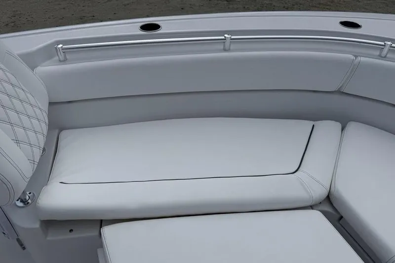 Slide: The Image of 2026 Sportsman Heritage 261 Center Console boat seating area with cushioned upholstery. - 8