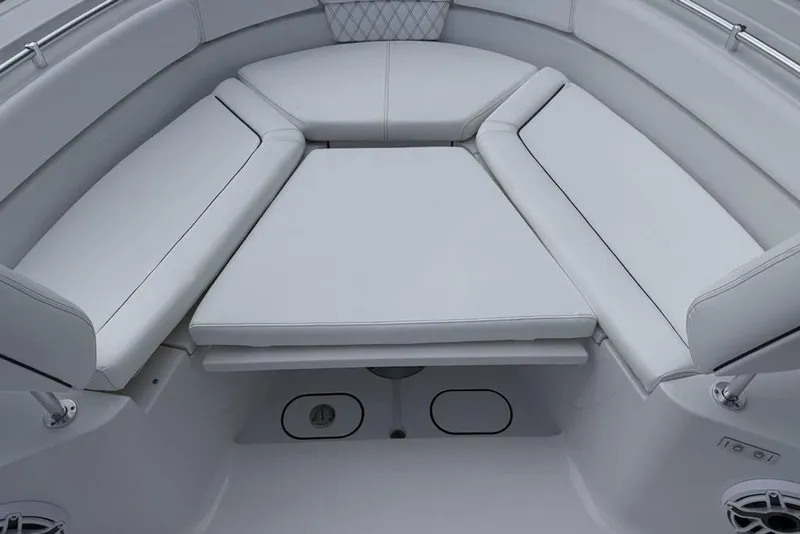 Slide: The Image of 2026 Sportsman Heritage 261 Center Console boat interior with cushioned seating. - 9