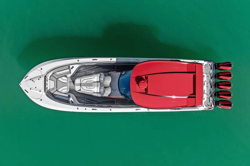 Slide: The Image of Top view of 2024 MTI V42 speedboat with red accents on turquoise water. - 17