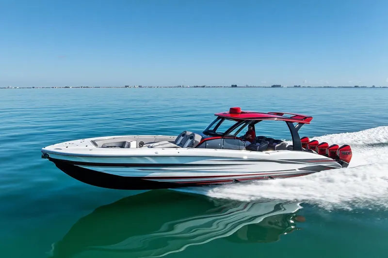 Slide: The Image of 2024 MTI V42 speedboat cruising on clear blue water under a sunny sky. - 20