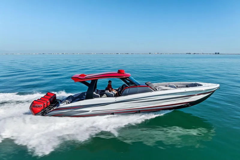 Slide: The Image of 2024 MTI V42 speedboat cruising on clear blue water, featuring powerful engines. - 22