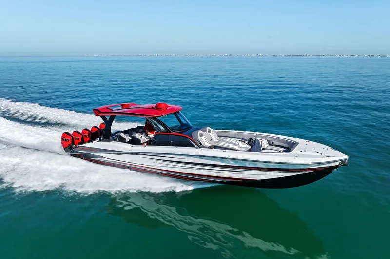 Slide: The Image of 2024 MTI V42 speedboat cruising on clear blue water, showcasing sleek design and powerful engines. - 25