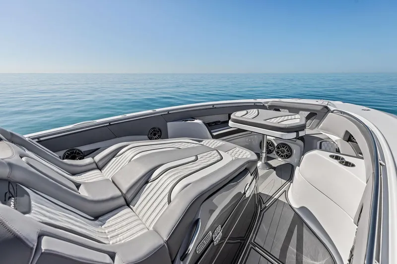 Slide: The Image of Luxurious 2024 MTI V42 boat interior with sleek seating and ocean view. - 34