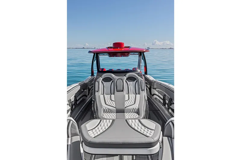 Slide: The Image of 2024 MTI V42 boat interior with luxurious seating on calm water. - 37