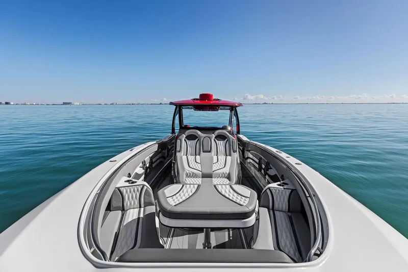Slide: The Image of 2024 MTI V42 boat with luxurious seating on calm ocean waters. - 38