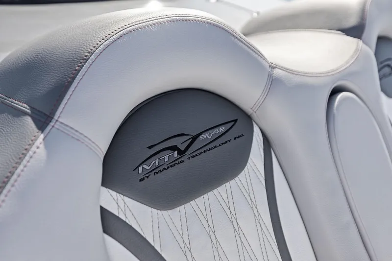 Slide: The Image of 2024 MTI V42 boat seat with logo, featuring sleek gray leather design. - 47