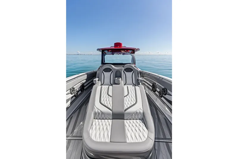 Slide: The Image of 2024 MTI V42 boat with luxurious seating on calm ocean waters. - 48