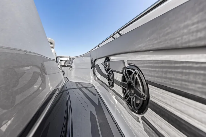 Slide: The Image of 2024 MTI V42 boat interior with sleek design and built-in speakers. - 53