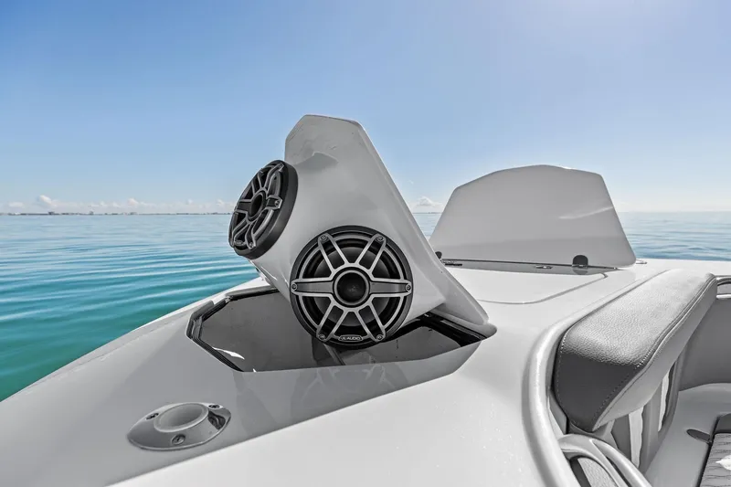Slide: The Image of 2024 MTI V42 boat with sleek speakers on a calm ocean. - 57
