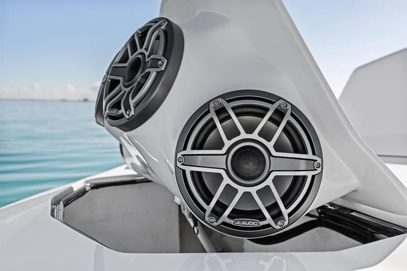 Slide: The Image of 2024 MTI V42 boat with JL Audio speakers on a sunny day. - 58