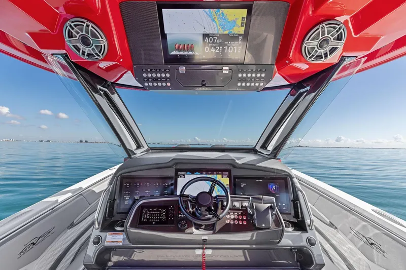 Slide: The Image of 2024 MTI V42 boat cockpit with advanced navigation system and ocean view. - 59