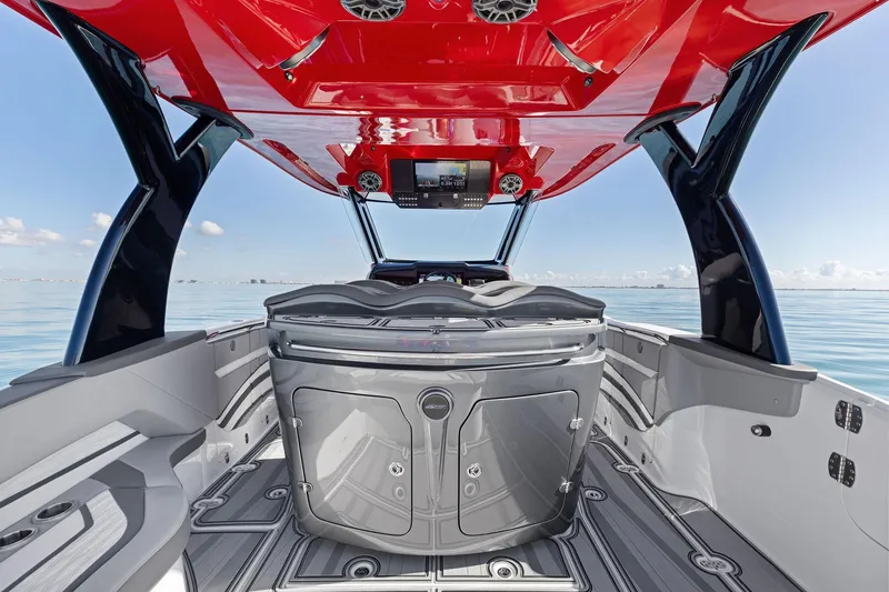 Slide: The Image of 2024 MTI V42 boat interior with sleek design and vibrant red canopy. - 61