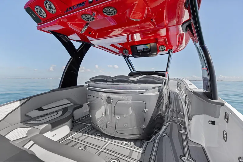 Slide: The Image of 2024 MTI V42 boat interior with sleek design, red canopy, and advanced navigation system. - 62