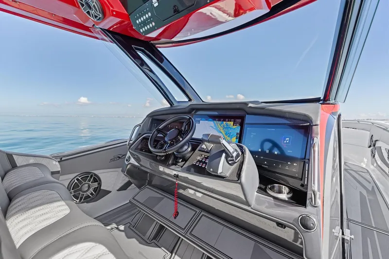 Slide: The Image of 2024 MTI V42 boat cockpit with advanced navigation and entertainment systems, sleek design. - 63
