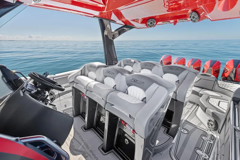 Slide: The Image of Luxury MTI V42 boat interior with plush seating and multiple engines, 2024 model. - 71