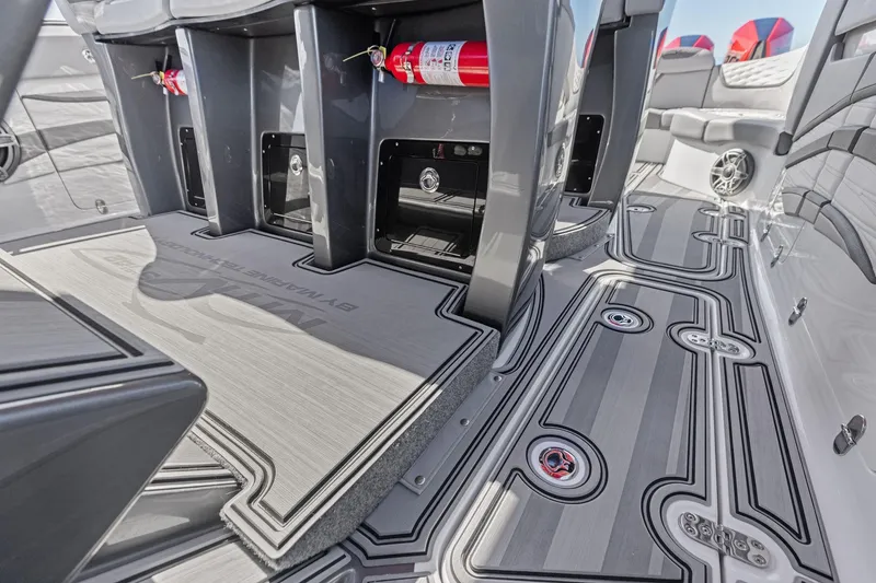 Slide: The Image of 2024 MTI V42 boat interior with sleek flooring and fire extinguishers. - 75