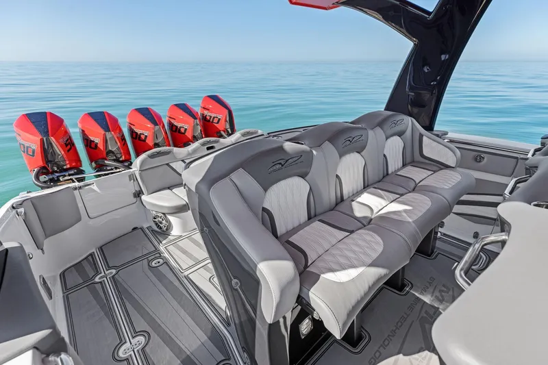 Slide: The Image of 2024 MTI V42 boat interior with luxury seating and powerful outboard engines. - 78